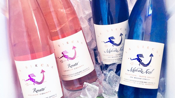 Bottles of La Sirena Rosato and Moscato Azul on ice